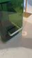 Custom engraved black leatherette beverage holder with gold initial at event